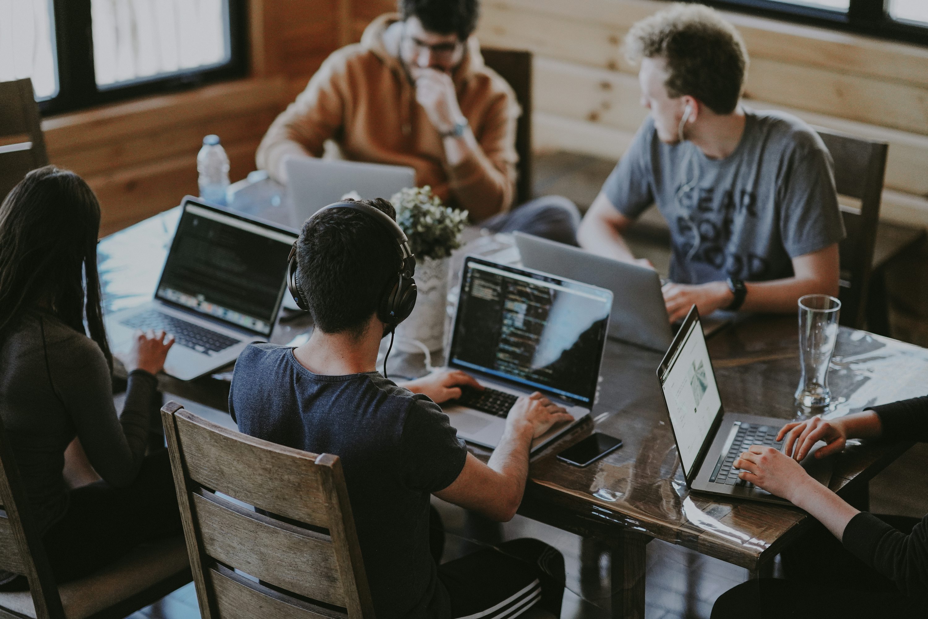 Modern workspace with people collaborating near a long table